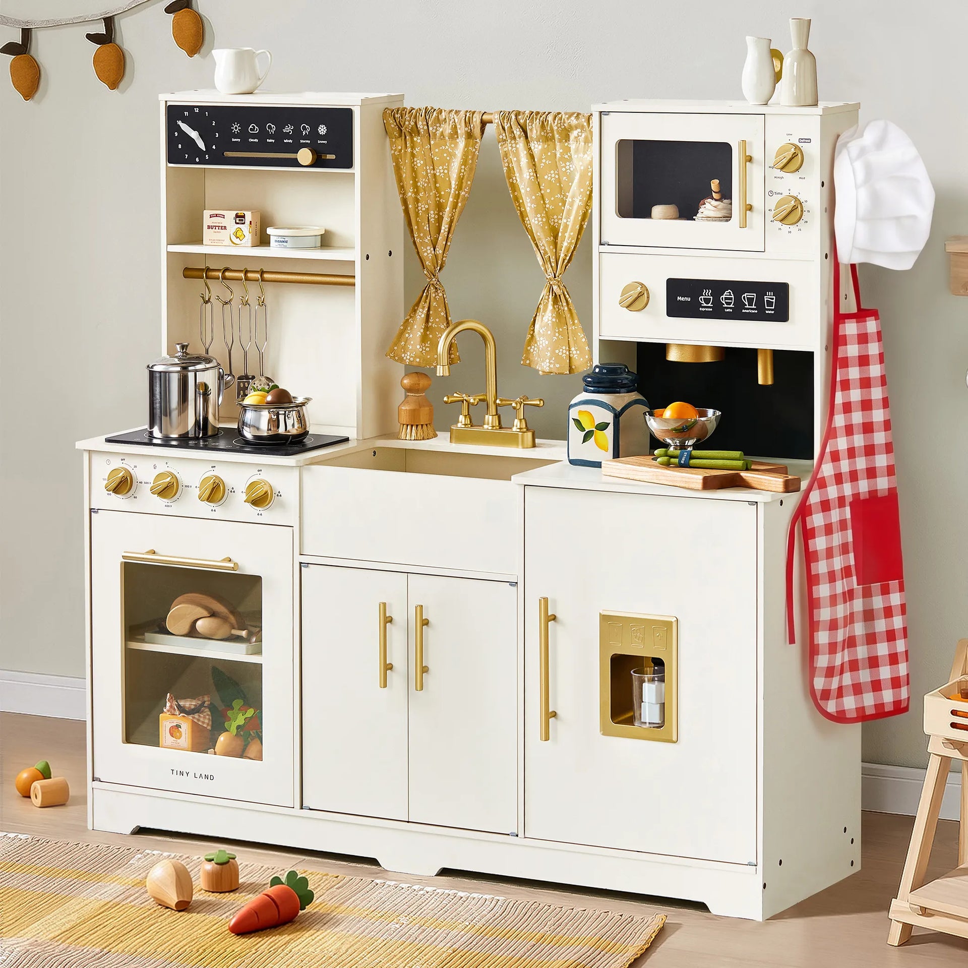 Children's play kitchen set with various appliances and utensils on a light gray background.